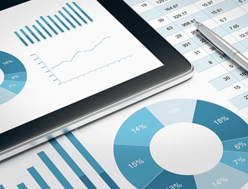 A tablet and some graphs on top of papers